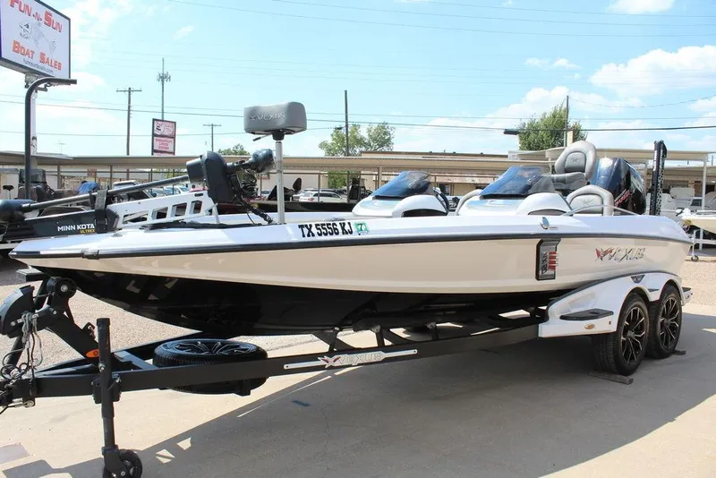 Slide: The Image of 2021 Vexus VX20 boat on trailer at dealership, sunny day. - 7