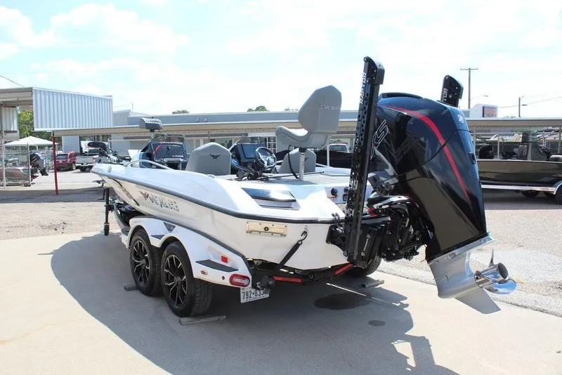 Slide: The Image of 2021 Vexus VX20 boat with powerful outboard motor, parked on a trailer in a sunny lot. - 8