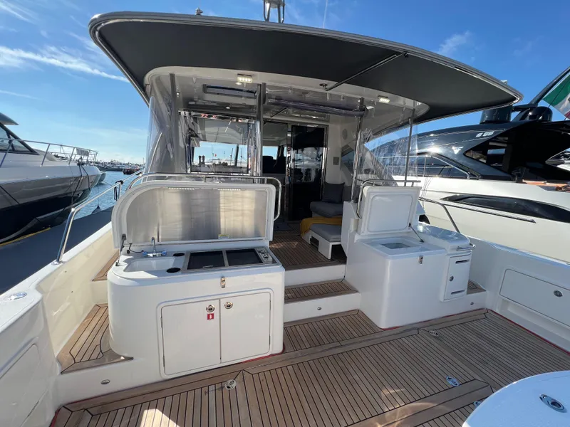 Slide: The Image of 2022 Riviera 505 SUV yacht with spacious deck and modern amenities. - 10