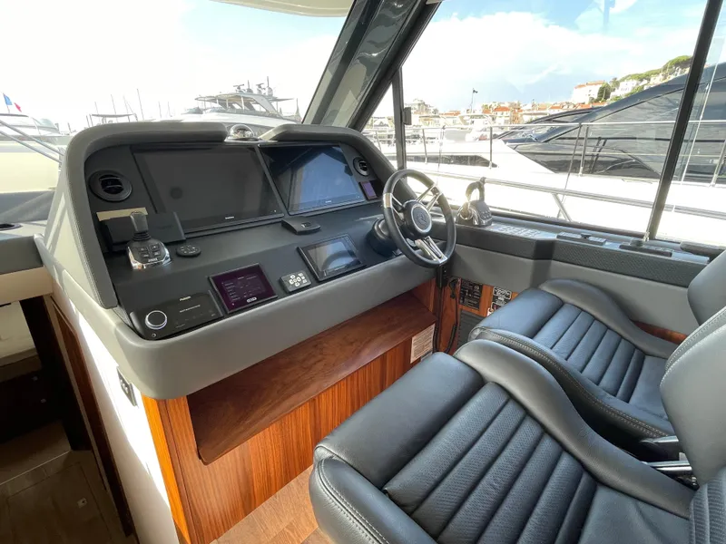 Slide: The Image of 2022 Riviera 505 SUV helm with modern controls and luxurious seating. - 26