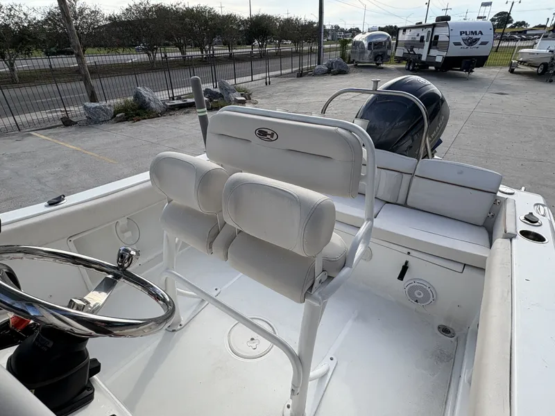 Slide: The Image of 2021 Sea Hunt Ultra 219 boat interior with seating and trolling motor. - 5