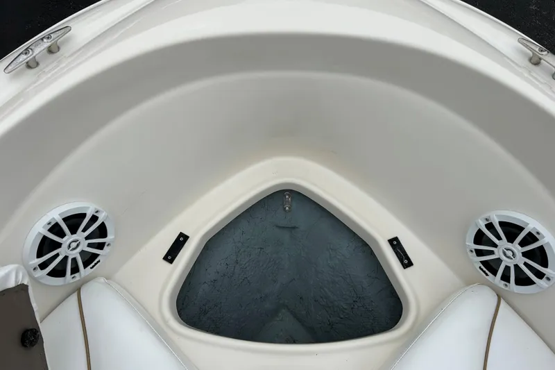 Slide: The Image of Bow seating area of a 2002 Bayliner 195 Capri boat with speakers. - 18