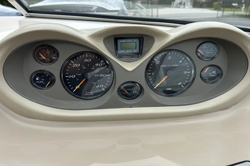 Slide: The Image of Dashboard of a 2002 Bayliner 195 Capri boat with various gauges and indicators. - 23