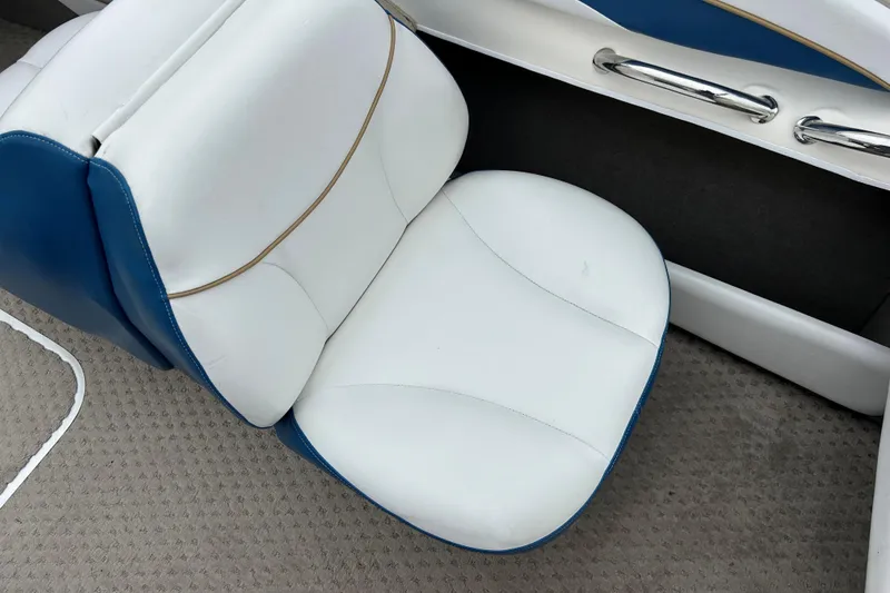 Slide: The Image of White and blue seat in 2002 Bayliner 195 Capri boat interior. - 26