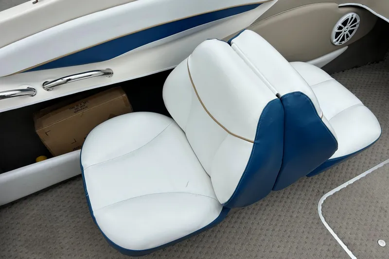 Slide: The Image of 2002 Bayliner 195 Capri boat interior with white and blue seating. - 29