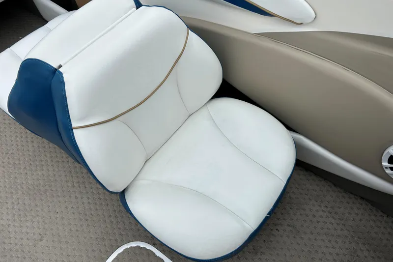 Slide: The Image of White and blue seat in 2002 Bayliner 195 Capri boat interior. - 30