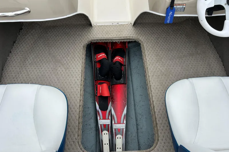 Slide: The Image of Interior of 2002 Bayliner 195 Capri with water skis stored in floor compartment. - 32