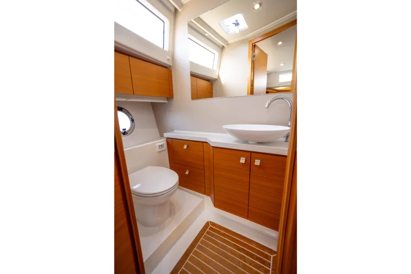 Slide: The Image of Luxurious bathroom in 2023 Greenline 48 Fly yacht with modern fixtures and wood accents. - 10