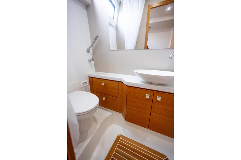 Slide: The Image of Modern bathroom in 2023 Greenline 48 Fly yacht with wooden cabinetry and sleek fixtures. - 14