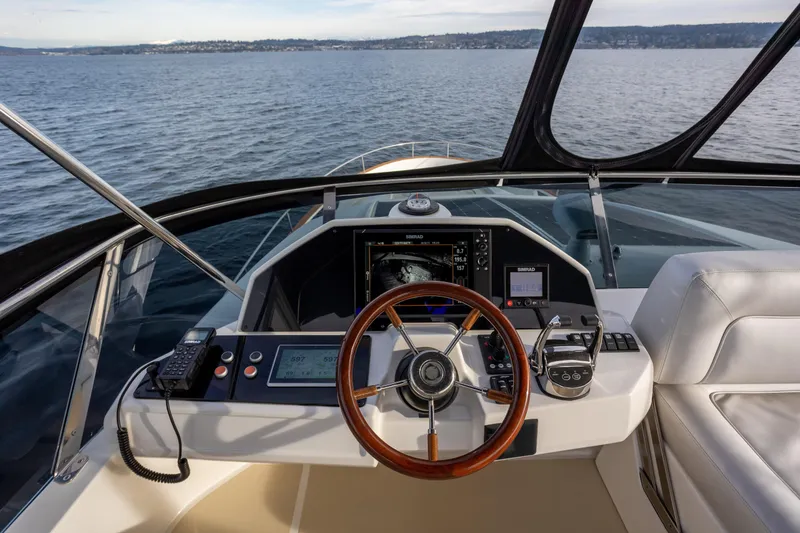 Slide: The Image of Helm of 2023 Greenline 48 Fly yacht with modern navigation equipment. - 19