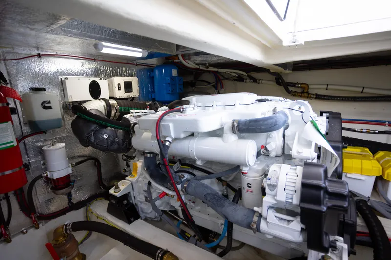 Slide: The Image of Engine room of 2023 Greenline 48 Fly yacht, featuring modern equipment and wiring. - 24