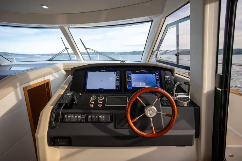 Slide: The Image of Helm of 2023 Greenline 48 Fly yacht with modern navigation equipment. - 6