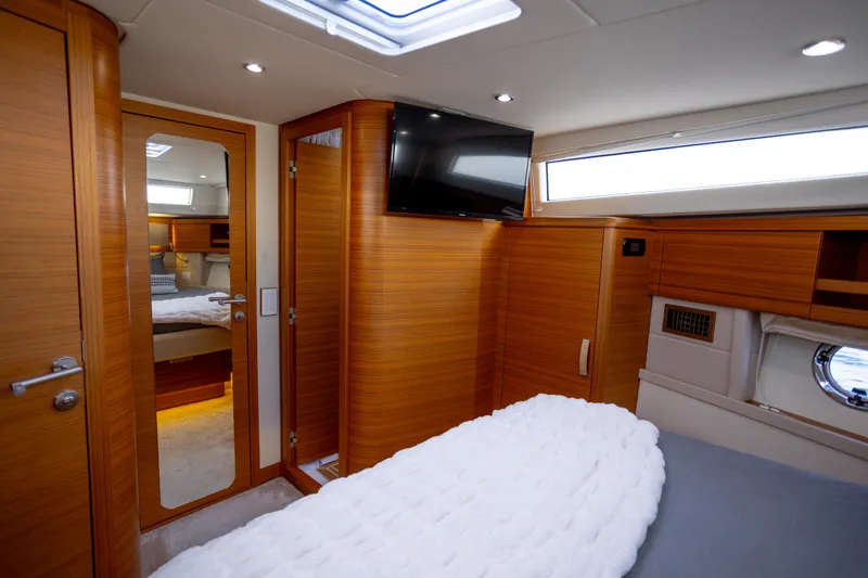 Slide: The Image of Luxurious interior of 2023 Greenline 48 Fly yacht with wood paneling and modern amenities. - 8