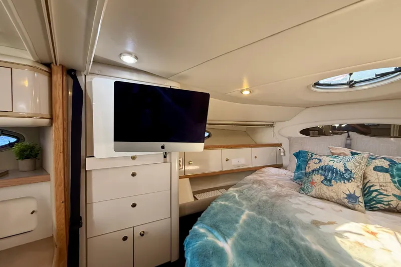 Slide: The Image of Luxurious 1997 Maxum 4100 SCR yacht cabin with cozy bed and modern amenities. - 11