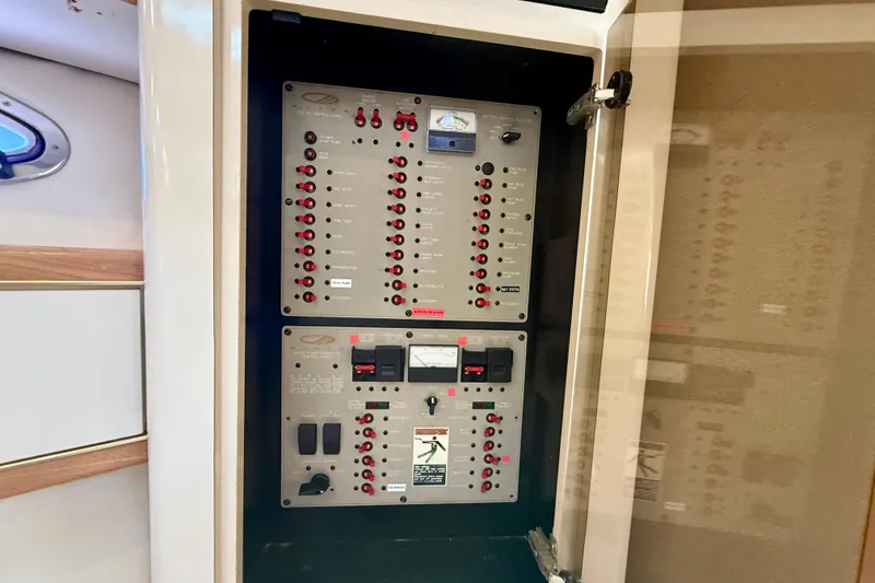 Slide: The Image of Electrical control panel inside a 1997 Maxum 4100 SCR boat cabin. - 21