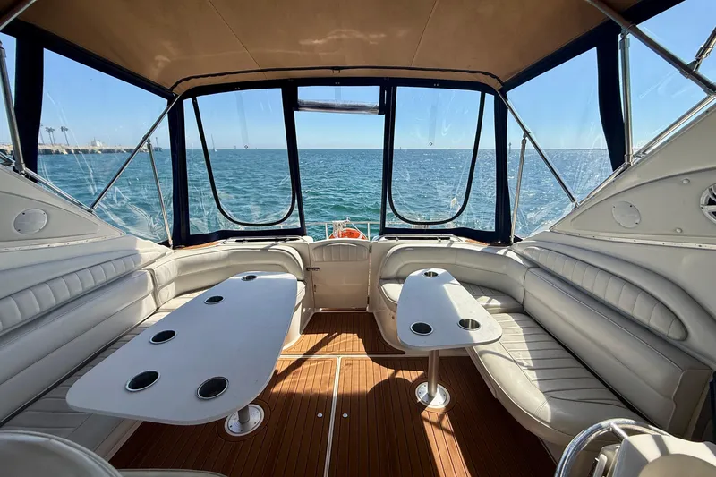 Slide: The Image of Luxurious interior of 1997 Maxum 4100 SCR yacht with ocean view and seating area. - 24