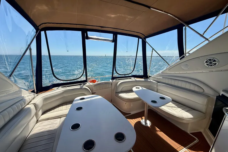 Slide: The Image of Interior of 1997 Maxum 4100 SCR yacht with ocean view and seating area. - 25