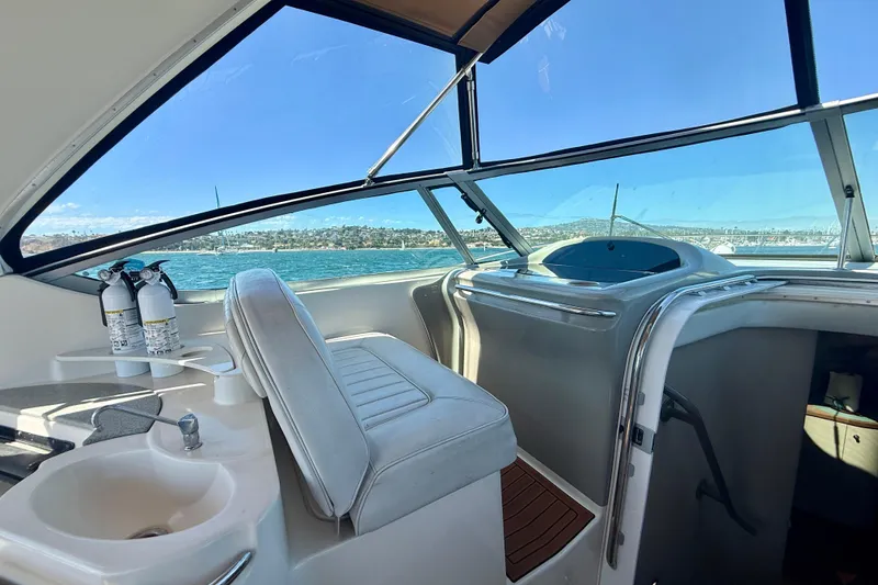 Slide: The Image of Interior view of 1997 Maxum 4100 SCR yacht with ocean backdrop. - 27