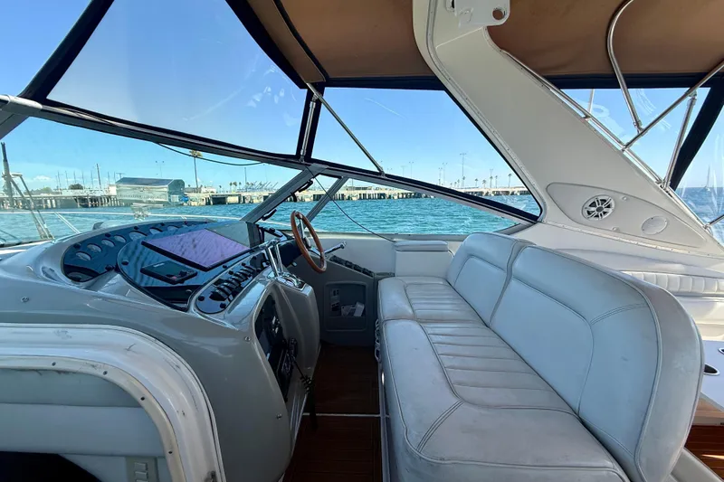 Slide: The Image of 1997 Maxum 4100 SCR yacht cockpit with leather seating and ocean view. - 28
