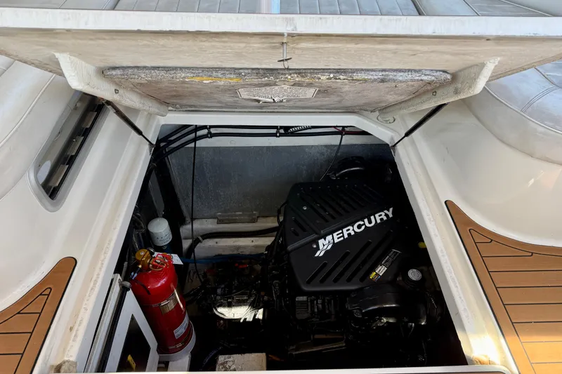 Slide: The Image of 1997 Maxum 4100 SCR engine compartment with Mercury engine and fire extinguisher. - 37