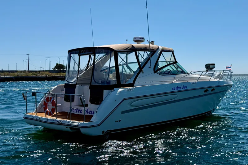 Slide: The Image of 1997 Maxum 4100 SCR yacht on water, sunny day, rear view. - 4