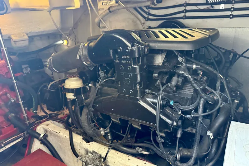 Slide: The Image of Engine compartment of a 1997 Maxum 4100 SCR boat, showcasing mechanical components. - 43