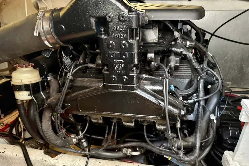 Slide: The Image of Engine of a 1997 Maxum 4100 SCR boat, showcasing intricate mechanical components. - 44