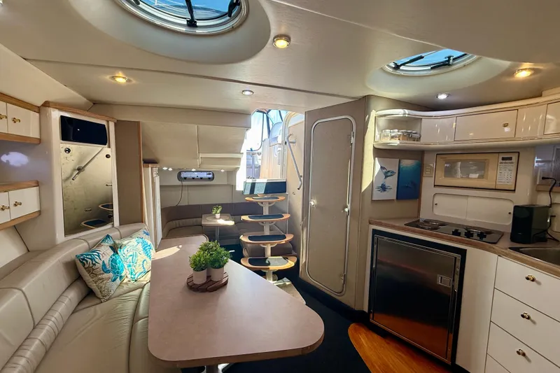Slide: The Image of Luxurious interior of a 1997 Maxum 4100 SCR yacht with modern amenities and elegant design. - 7