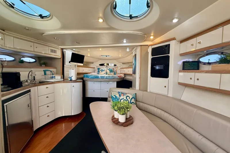 Slide: The Image of Luxurious interior of 1997 Maxum 4100 SCR yacht with modern amenities and elegant design. - 9