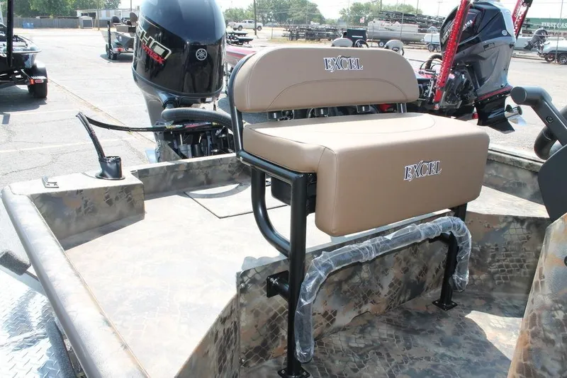 Slide: The Image of 2026 Excel 1854 F4 Shallow Water boat with tan seating and Yamaha outboard motor. - 4