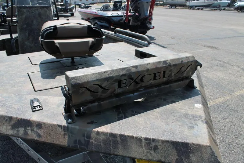 Slide: The Image of 2026 Excel 1854 F4 Shallow Water boat with camouflage design, parked outdoors. - 10