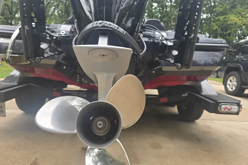 Slide: The Image of 2023 Nitro Z21 XL Pro boat propeller close-up, parked on a trailer. - 14