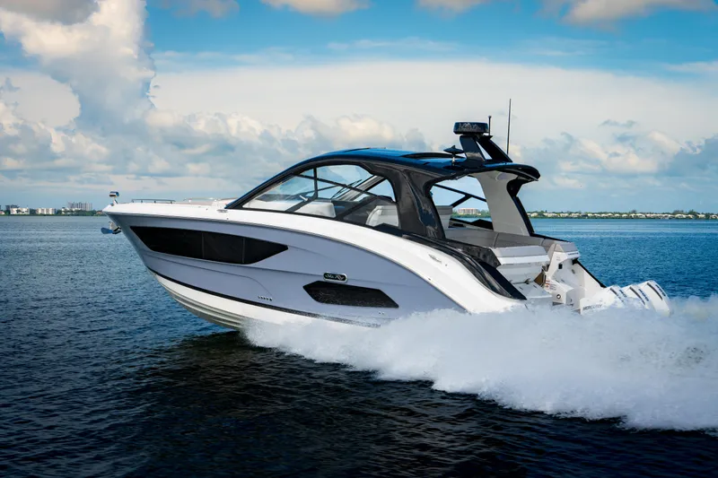 The Image of 2023 Sea Ray Sundancer 370 OB cruising on open water. - 0