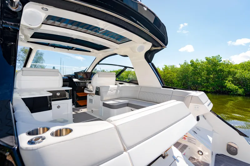 Slide: The Image of 2023 Sea Ray Sundancer 370 OB interior with luxurious seating and modern amenities. - 13