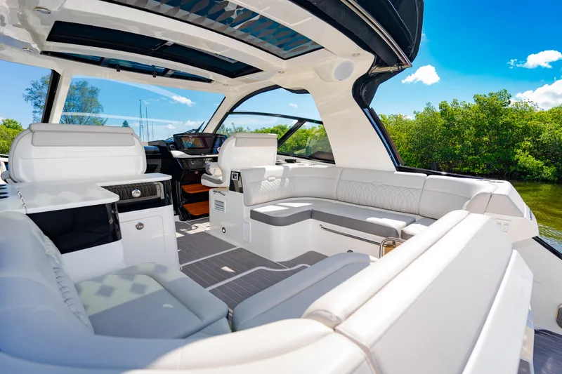Slide: The Image of Luxurious interior of 2023 Sea Ray Sundancer 370 OB yacht with white seating. - 14