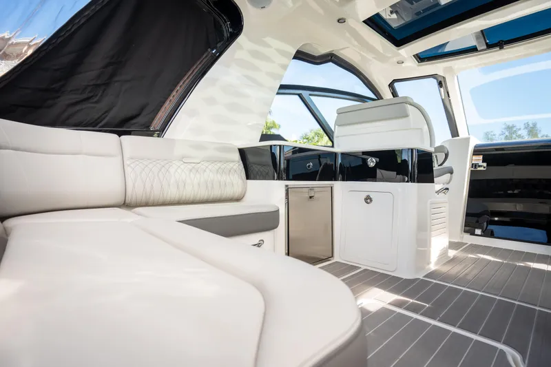 Slide: The Image of Interior of 2023 Sea Ray Sundancer 370 OB luxury yacht with modern seating and sleek design. - 18