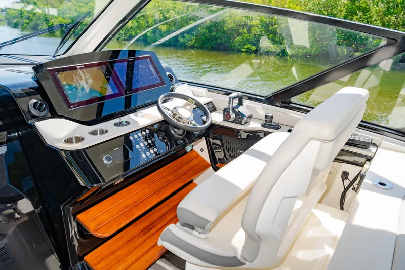 Slide: The Image of 2023 Sea Ray Sundancer 370 OB helm with advanced navigation system and luxurious seating. - 22