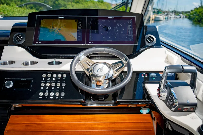 Slide: The Image of 2023 Sea Ray Sundancer 370 OB helm with advanced navigation system and controls. - 24