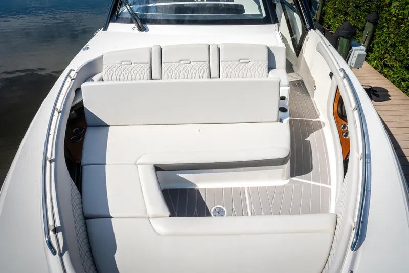 Slide: The Image of 2023 Sea Ray Sundancer 370 OB boat with luxurious seating and sleek design. - 27