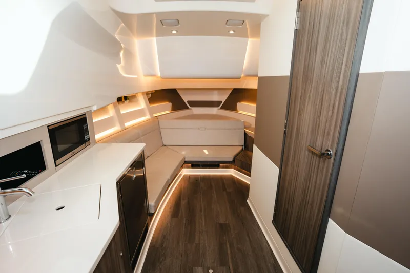 Slide: The Image of Interior of 2023 Sea Ray Sundancer 370 OB with modern kitchen and seating area. - 29