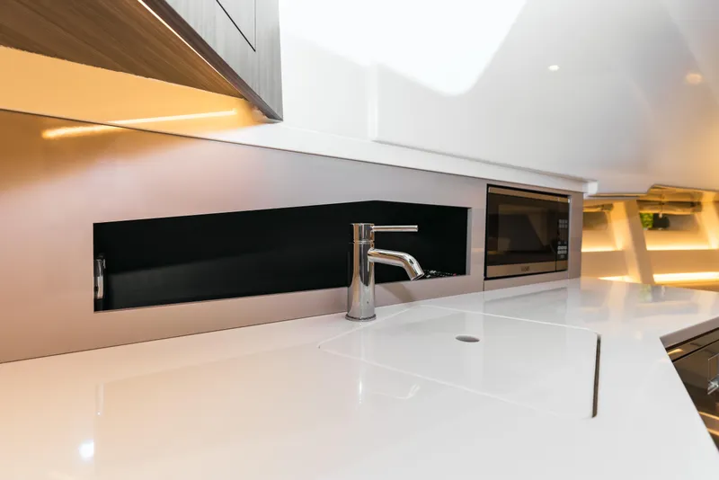 Slide: The Image of Modern kitchen area in 2023 Sea Ray Sundancer 370 OB yacht. - 34