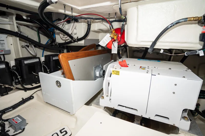 Slide: The Image of Engine compartment of 2023 Sea Ray Sundancer 370 OB with electrical components and wiring. - 42