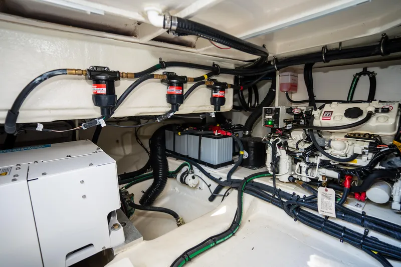 Slide: The Image of Engine compartment of 2023 Sea Ray Sundancer 370 OB with wiring and components. - 43