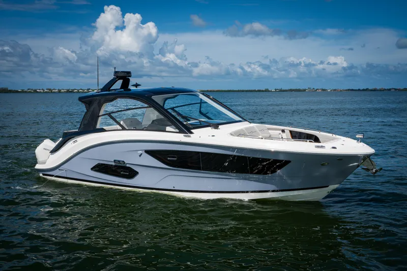 Slide: The Image of 2023 Sea Ray Sundancer 370 OB luxury motorboat on open water. - 6
