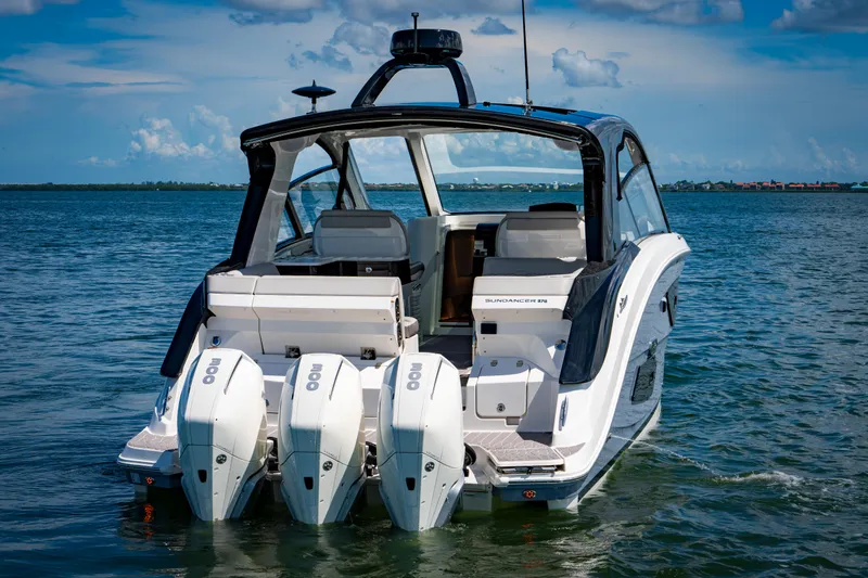 Slide: The Image of 2023 Sea Ray Sundancer 370 OB luxury boat with triple outboard engines. - 9