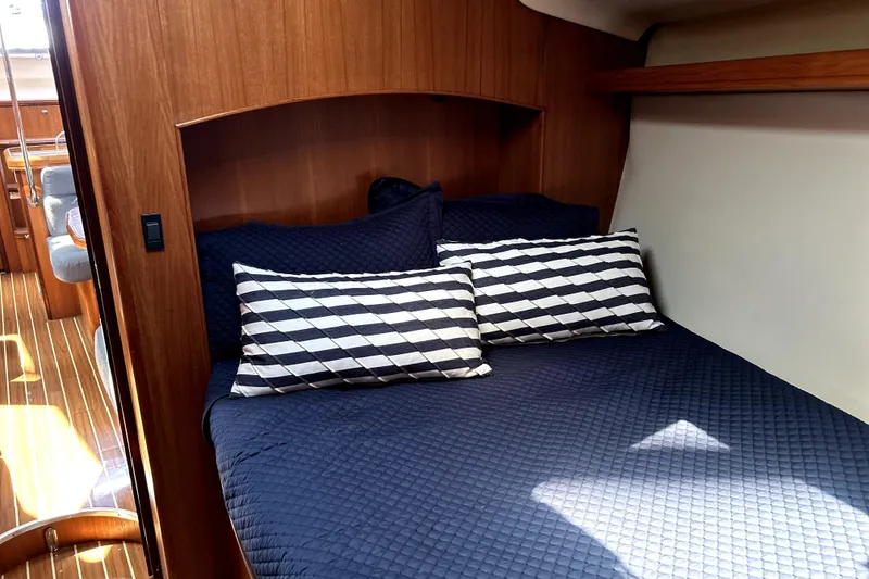 Slide: The Image of 2007 Hunter 41 Deck Salon interior with bed, sink, and bathroom. - 10