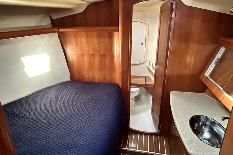 Slide: The Image of Control panel of a 2007 Hunter 41 Deck Salon with VHF radio and warning labels. - 12