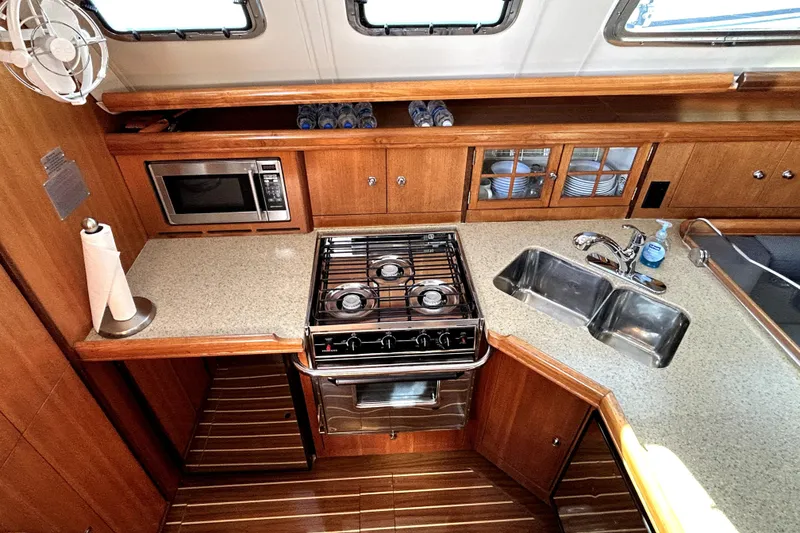 Slide: The Image of 2007 Hunter 41 Deck Salon bathroom with shower, sink, and towel. - 23