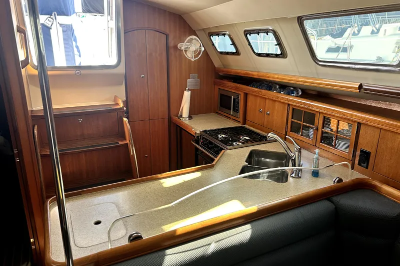 Slide: The Image of 2007 Hunter 41 Deck Salon bathroom with sink, toilet, and shower. - 24