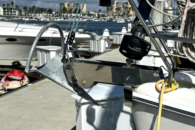 Slide: The Image of 2007 Hunter 41 Deck Salon yacht with inflatable dinghy docked at marina. - 31